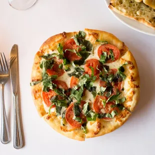 a pizza and a glass of wine