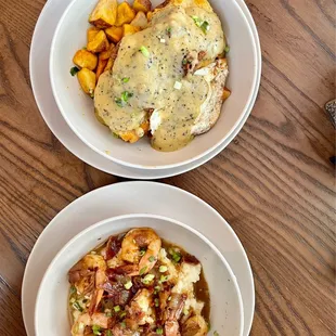 Shrimp and Grits (bottom) and chicken biscuits smothered white gravy potatoes (top)
