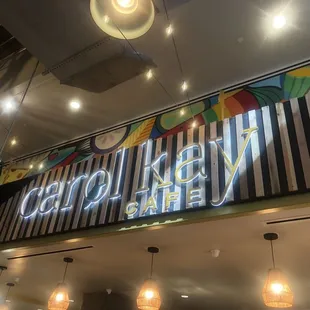 the neon sign for carol kay's