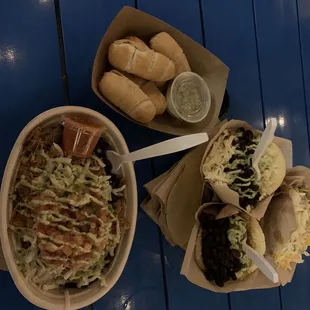 two bowls of food on a blue table