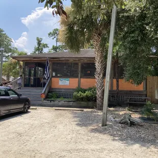 Charming building with a lovely screened in front porch
