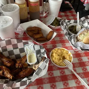 Wings, hush puppies, collards, mac &amp; cheese, pork sandwich, greens beans