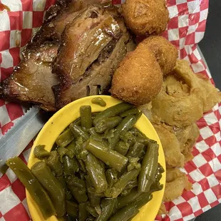The Beef Brisket Plate with onion rings and green beans