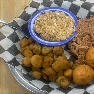 Half of split plate with fried okra, red slaw, pulled BBQ Pork, hushpuppies
