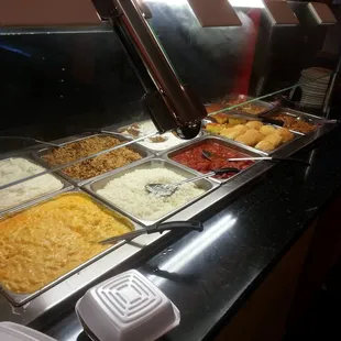 a buffet with a variety of food items