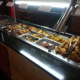 a buffet with a variety of food items