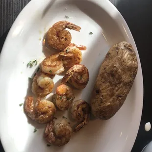 a plate of shrimp and potatoes