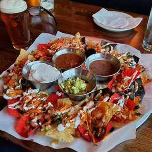 Chicken nachos with sour cream and guacamole. Absolutely amazing