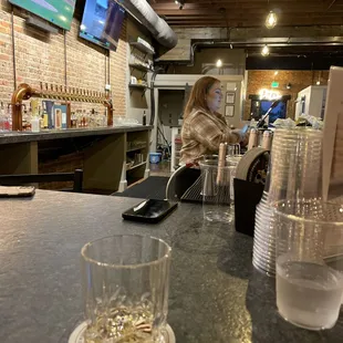 a woman sitting at the bar