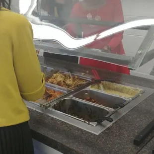 My wife and daughters helping themselves to the buffet.