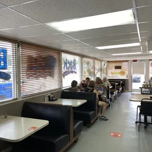 diners sitting at tables in a restaurant