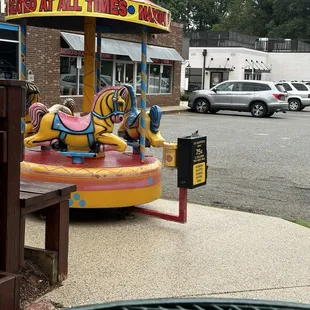 Merry go round and they have a loud announcement on dos and don&apos;ts of getting on this ride