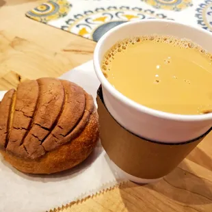 a cup of coffee and a pastry