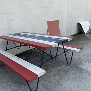 Only bench outside in the parking lot