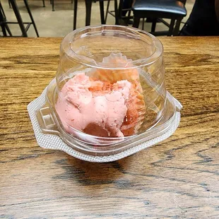 two scoops of pink ice cream