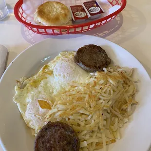 Breakfast special with 2 eggs and sausage patties.