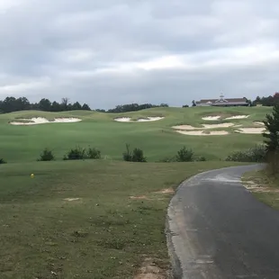 #18, 387 yard par 4, lined with fairway bunkers and green side bunkers.