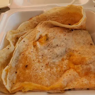 a close up of a tortilla in a styrofoam container