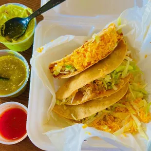 potato, chicken, shredded beef tacos with guacamole, green salsa &amp; hot sauce