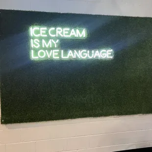a neon sign that reads ice cream is my love language