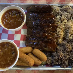 Ribs, beef, pork, chicken, double baked beans, hush puppies.