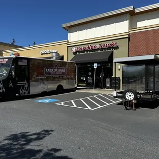 Storefront with catering truck and smoker