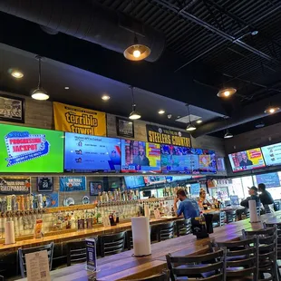 bar seating and televisions