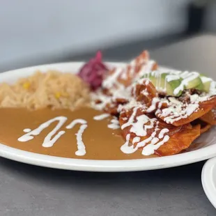 Chilaquiles rojo with a side of machaca