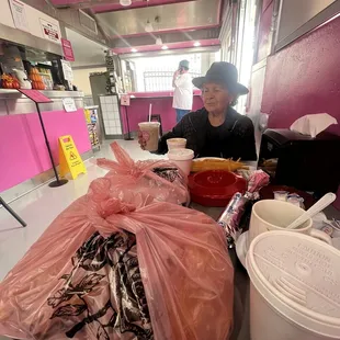 a woman preparing food in a kitchen