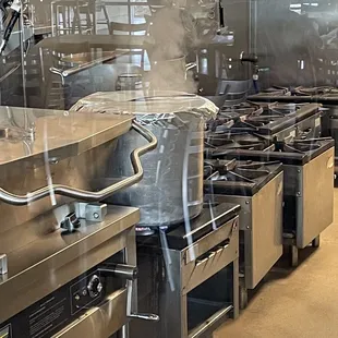 a restaurant kitchen with stainless steel appliances