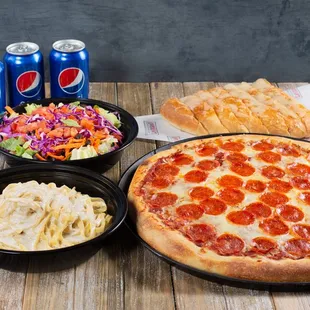 a pizza, salad, and soda