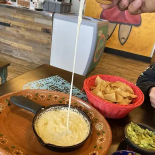 Queso fundido cheese pull