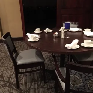 Table (breakfast buffet in background closed due to low capacity; breakfast menu available)