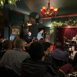 a group of people sitting at tables