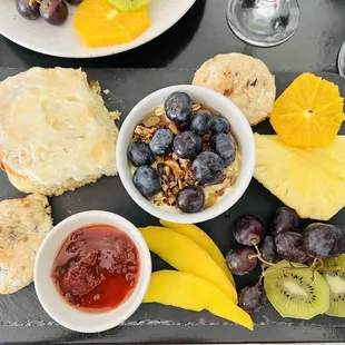 a platter of fruit and bread