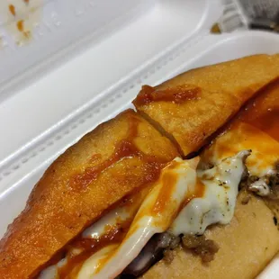 a sandwich in a styrofoam container