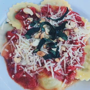 a pasta dish with spinach and cheese