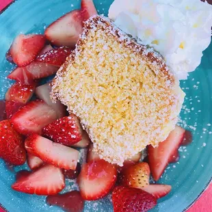 a piece of cake and strawberries