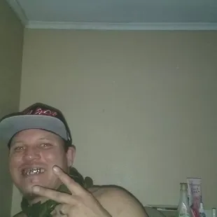 a shirtless man in a bathroom