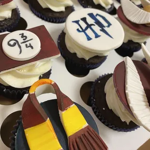 a box of cupcakes decorated like harry potters
