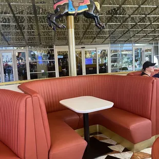 a carousel horse in the background