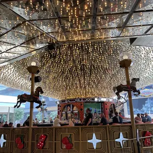people sitting at the top of the carousel