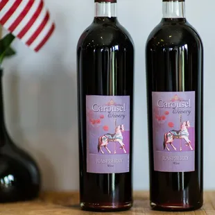 two bottles of wine on a table