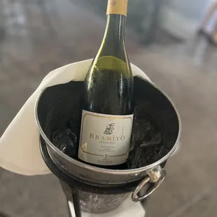 a bottle of wine in a bucket