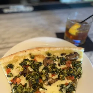 Pesto pizza and an angels envy old fashioned.