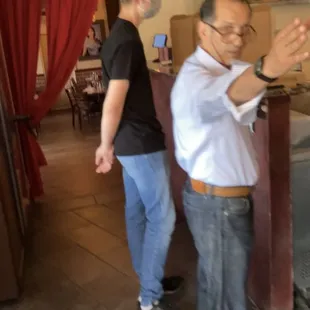 a man and a woman standing in a room