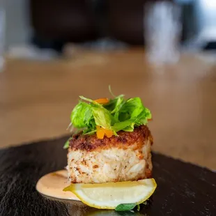 Crab Cake with Calabrian chili aioli, fresh herb salad, lemon