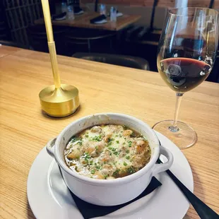 Tuscan Onion Soup with rich spiced beef broth + braised beef, caramelized red onion, sage, fontina + grana padano