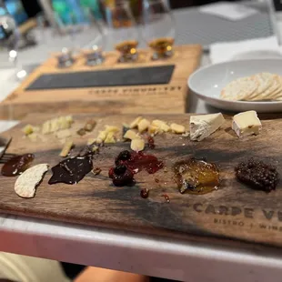 cheese and crackers on a cutting board