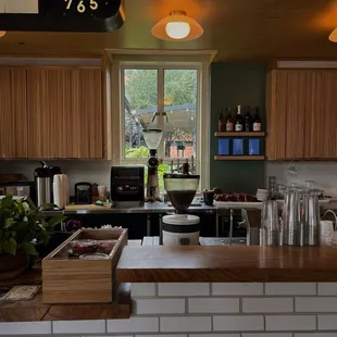 a kitchen with a clock on the wall